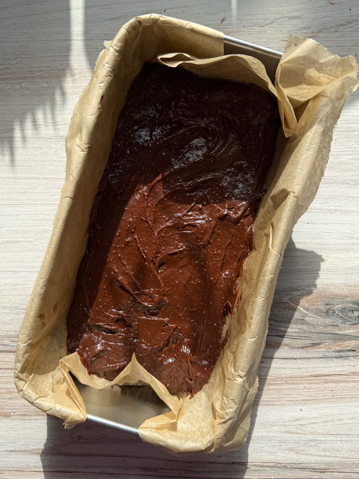 Unbaked brownies in loaf pan.