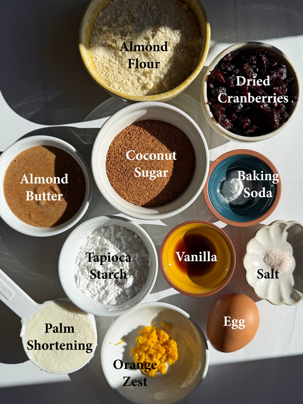 Ingredients needed to make gluten free cranberry orange cookies.