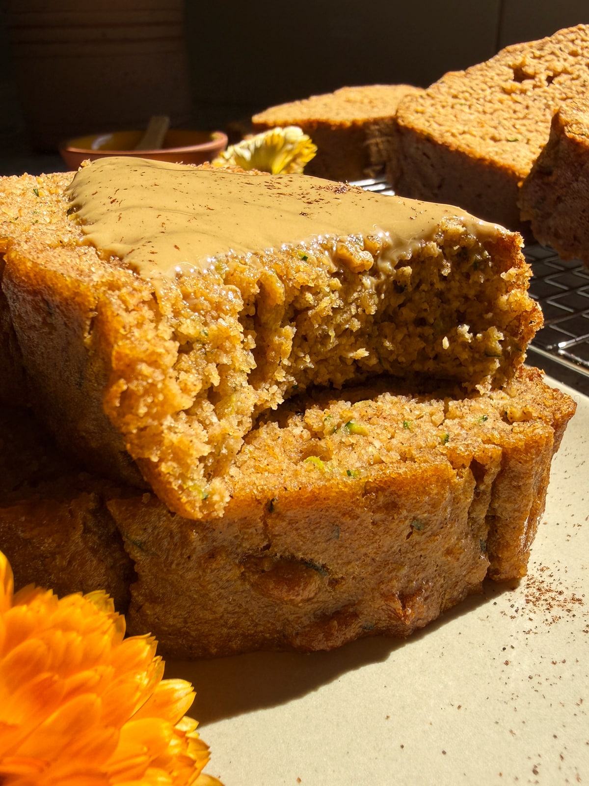 Slice of bread topped with sunbutter and a bite taken out to show the texture.