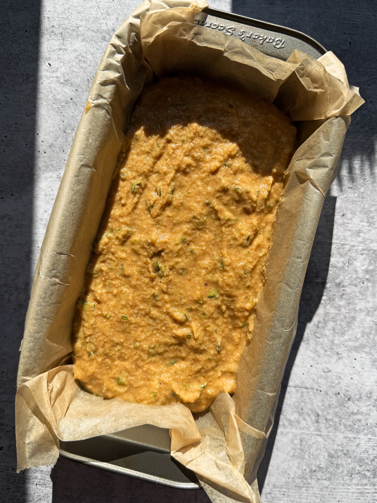 Batter in lined loaf pan.