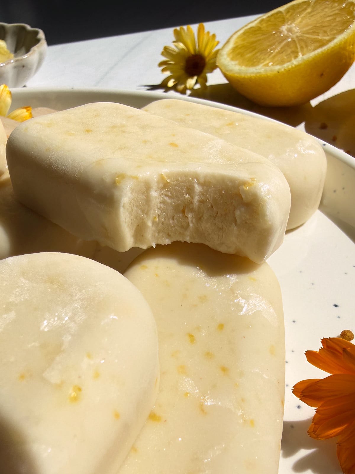 Bite of a lemon bar to show the texture.