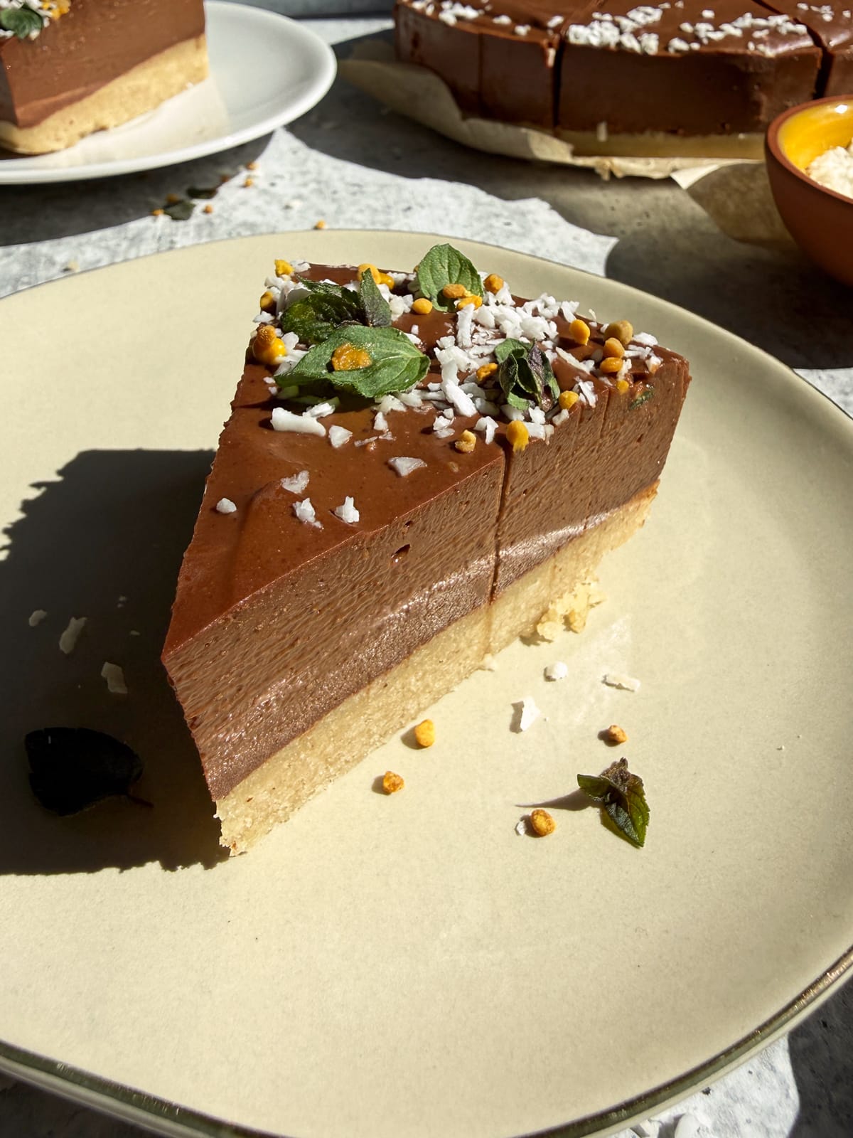 Slice of mint chocolate tart on a plate.