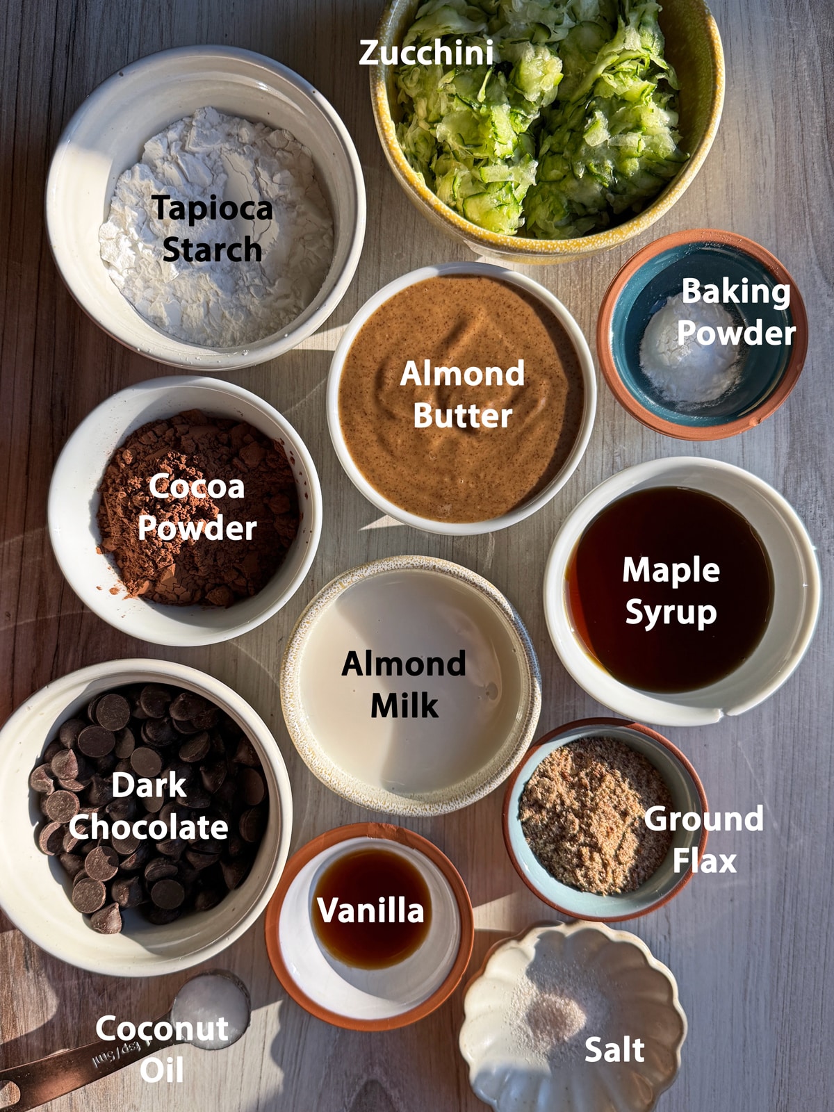 Ingredients needed to make chocolate zucchini donuts.