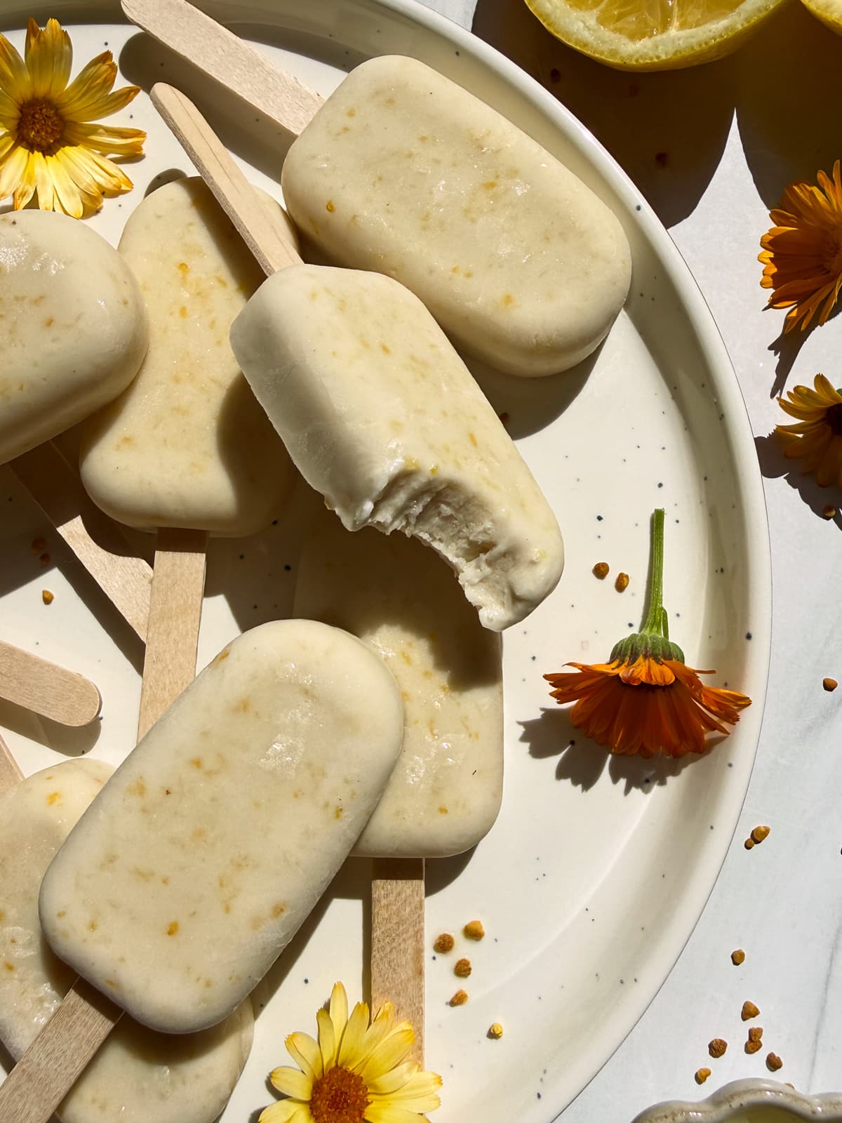 Top down view of ice cream bars on a plate.