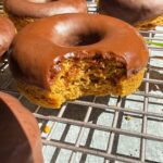 Bite of a donut to show the inside texture.