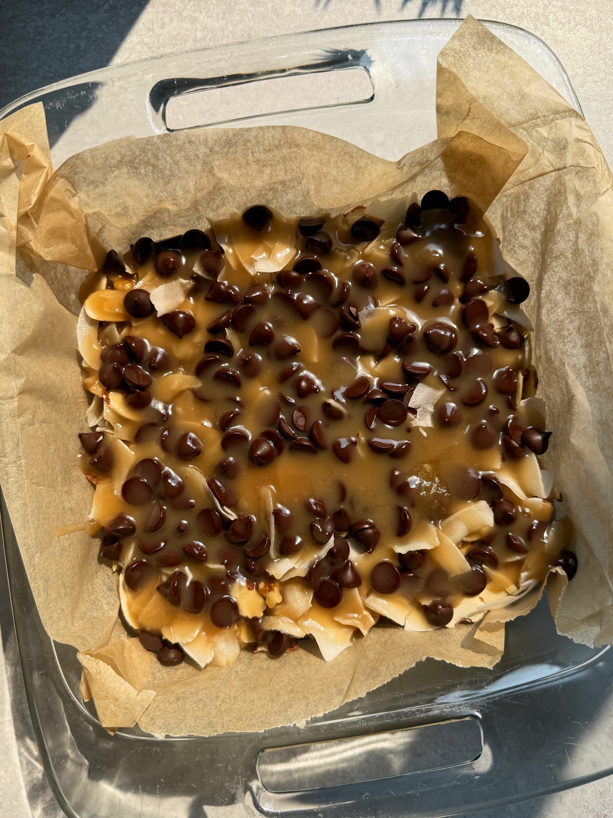 Unbaked magic bars, ready to cook in the oven.