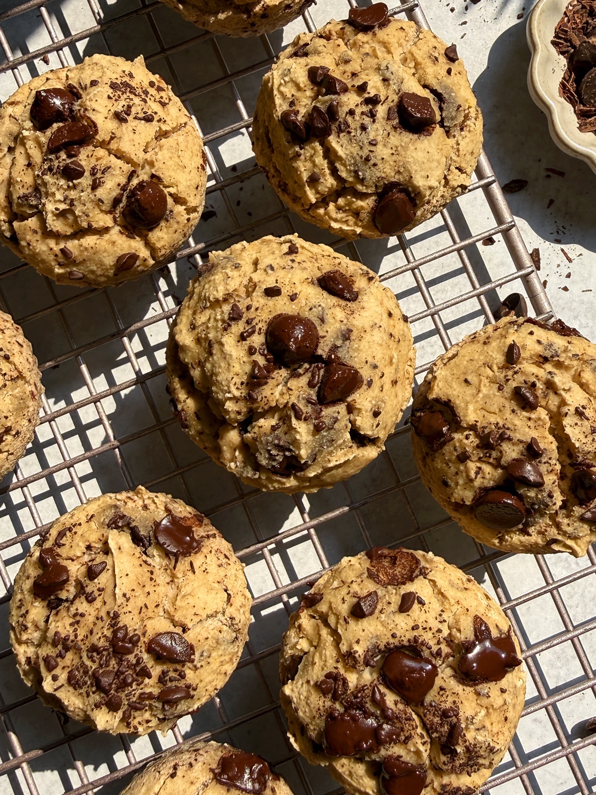Top down image of buckwheat muffins on wire cooling rack.