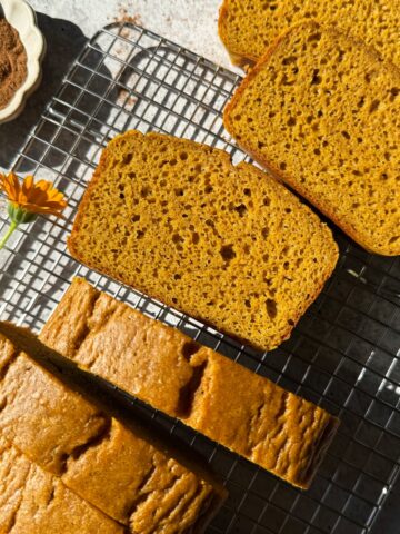 Sliced bread on wire cooling rack.