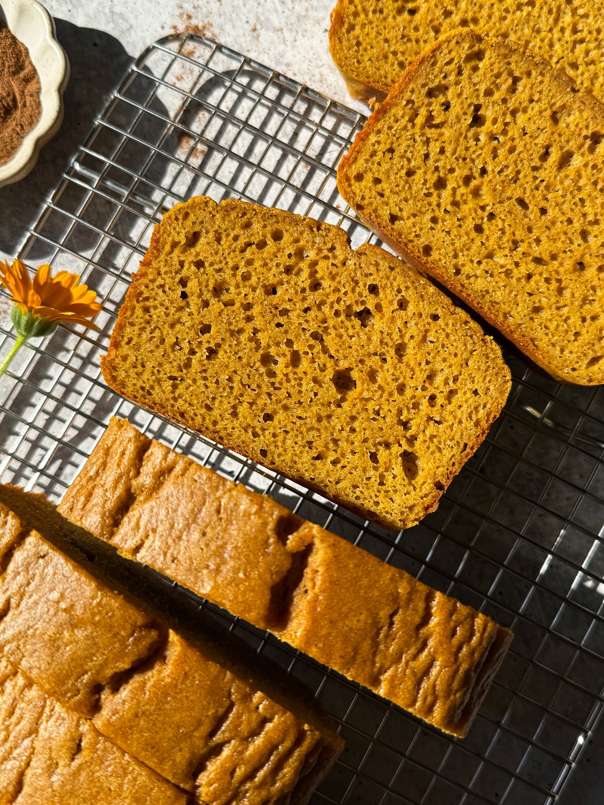 Sliced bread on wire cooling rack.