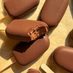 Bite of a chocolate yogurt popsicle.