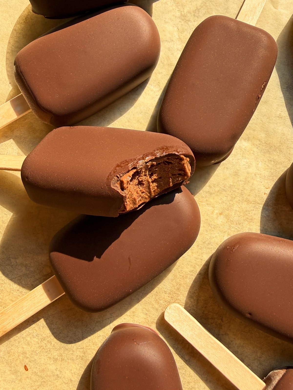 Bite of a chocolate yogurt popsicle.
