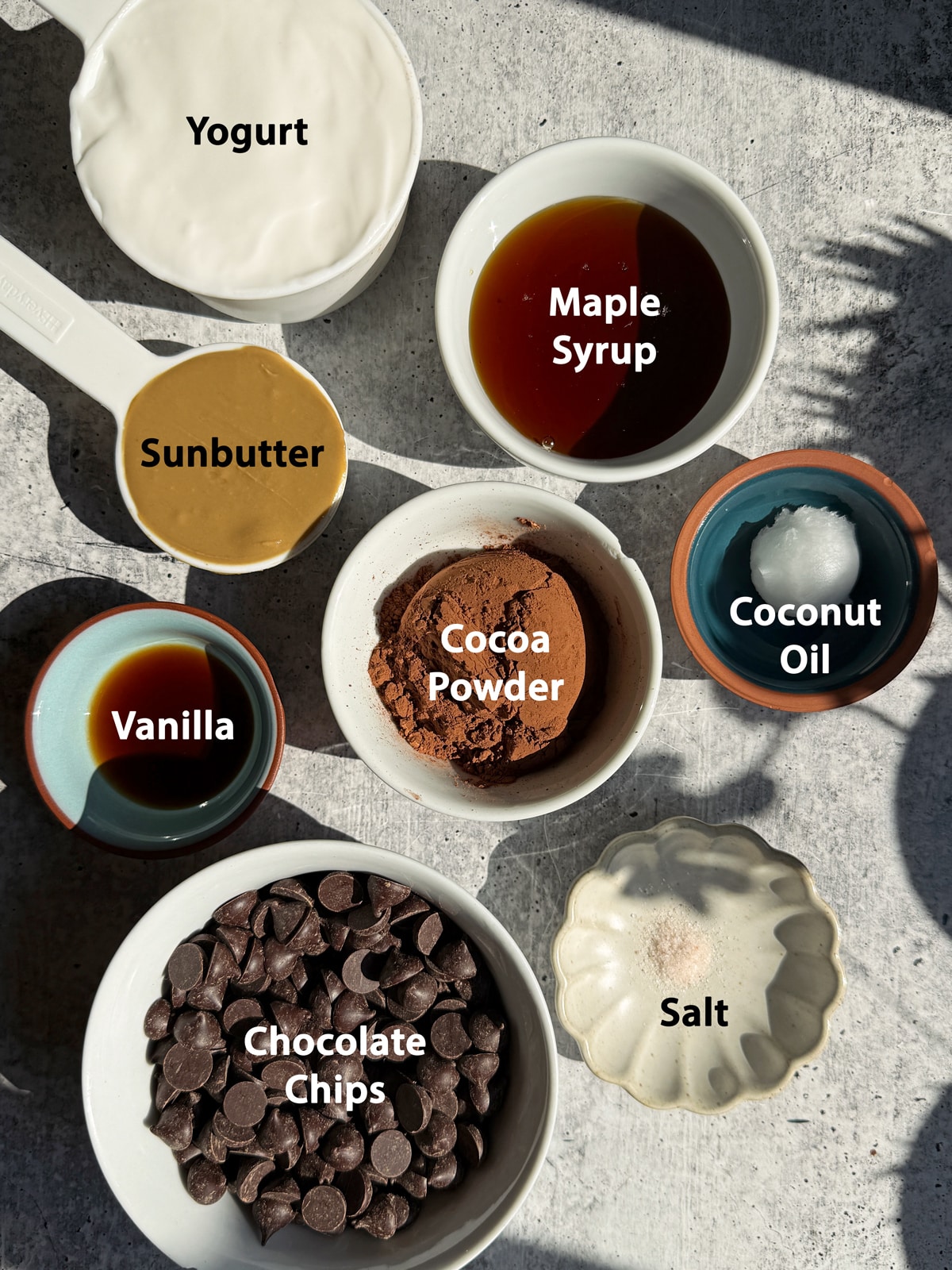 Ingredients needed to make chocolate yogurt popsicles.