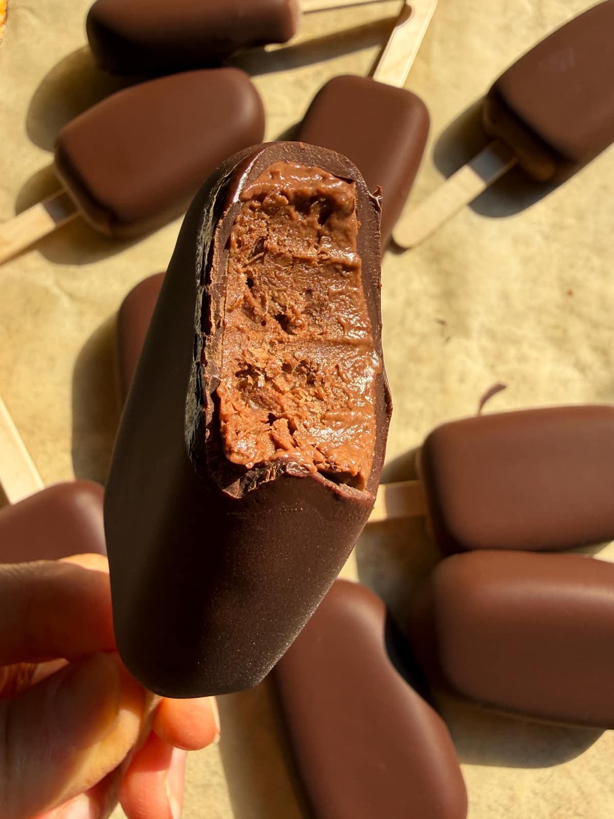 Bite of a popsicle to show the texture.