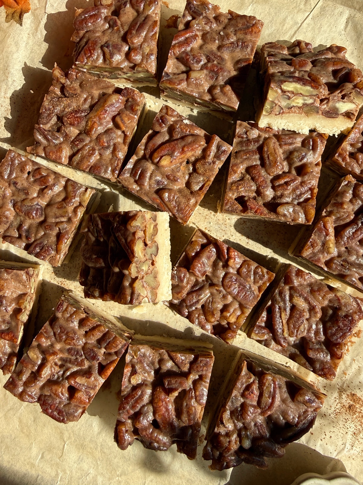 Top down view of cut maple pecan bars.