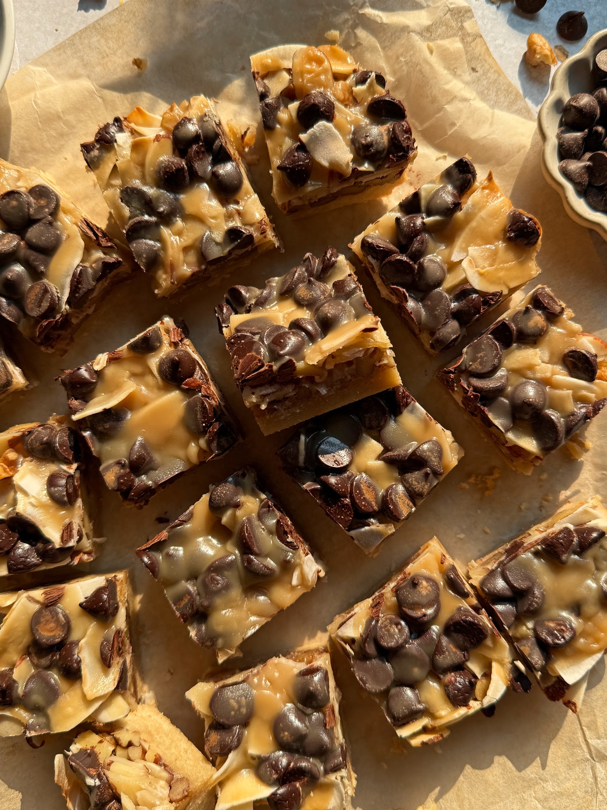 Cut paleo magic cookie bars.