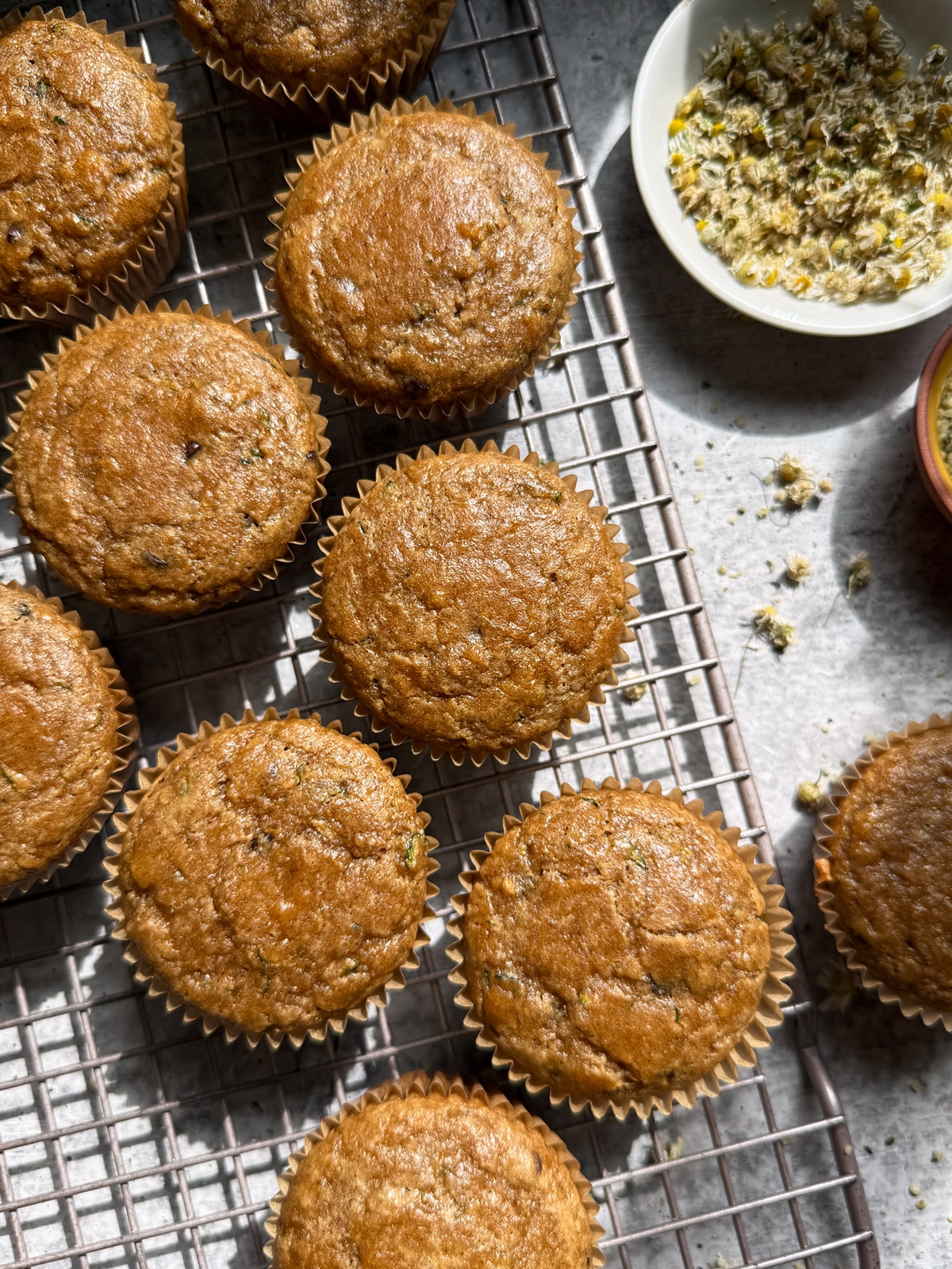 Top down view of muffins on wire cooling rack.