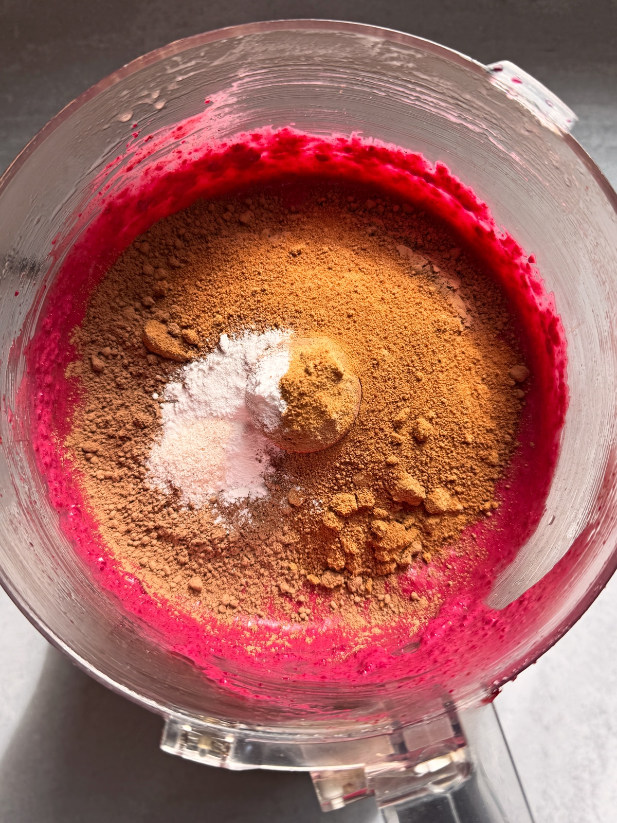 Adding the dry ingredients to the blended wet ingredients.