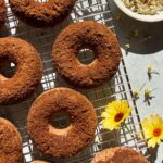 Top down view of donuts on wire cooling rack.