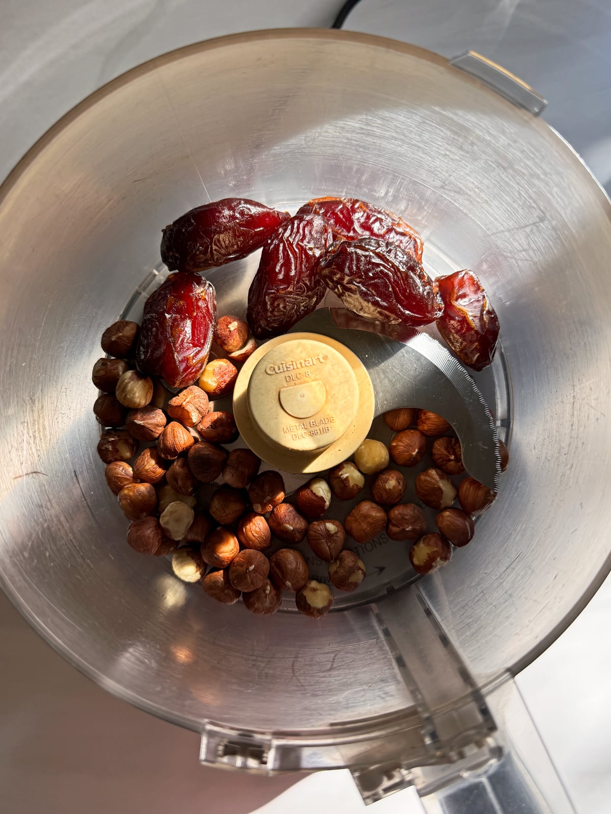 Dates and hazelnuts in food processor.