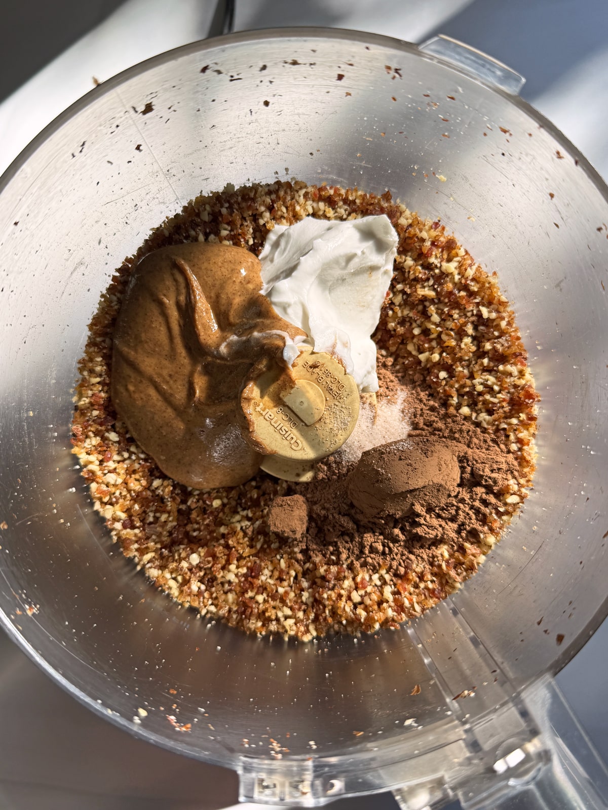 Adding in the remaining filling ingredients to the food processor.