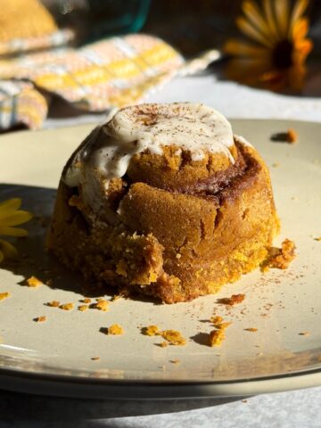 Close up of a cinnamon roll on a plate.