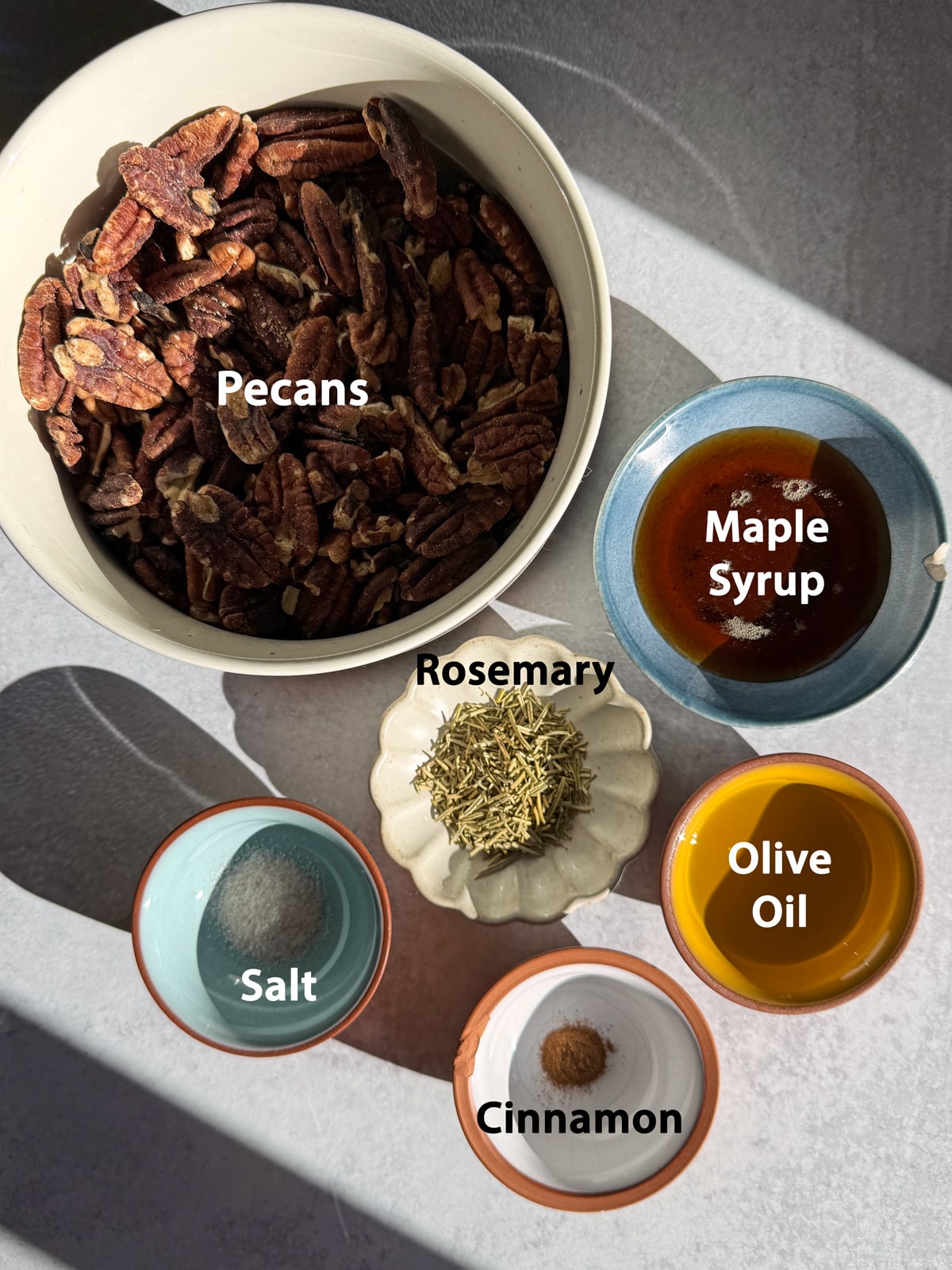 Ingredients needed to make maple rosemary pecans.