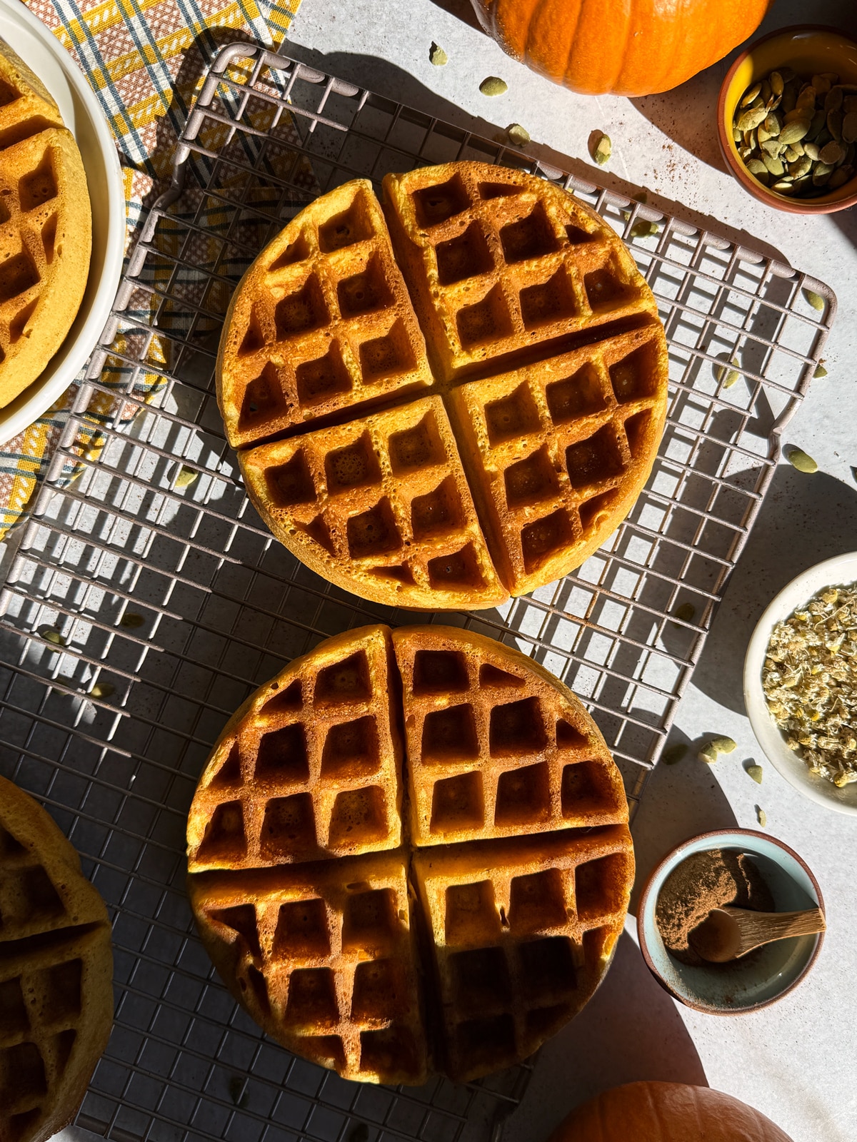 Waffles cooling on wire cooling rack.